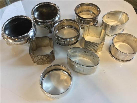 Collection of silver napkin rings and pair of silver salts